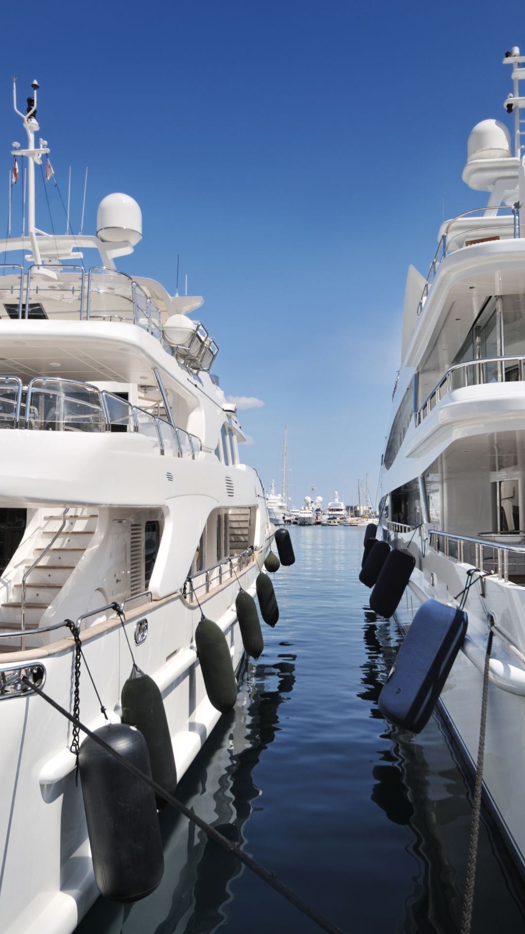 Superyachts docked in Caribbean marina