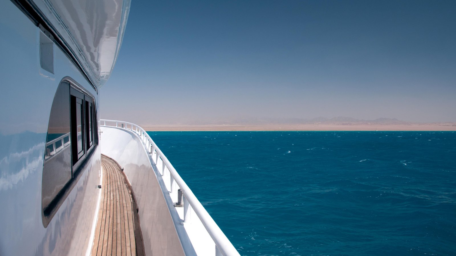 Yacht deck overlooking turquoise Caribbean waters
